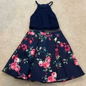 Navy blue and Floral pattern dress with a mesh material in the middle.